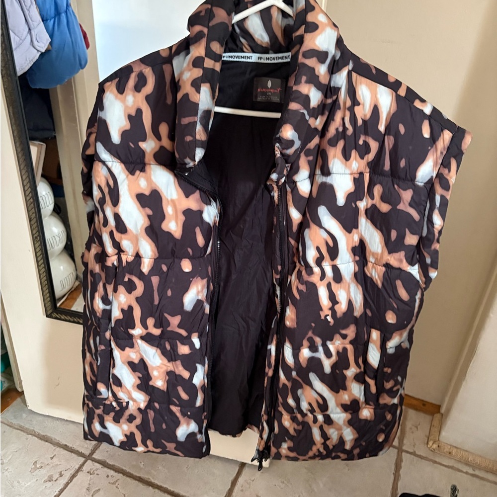 Free people movement in a bubble puffer vest